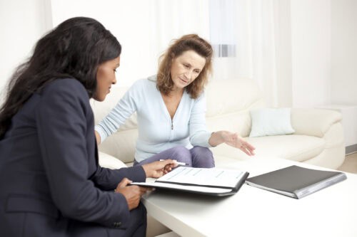 woman helping customer with design documentation