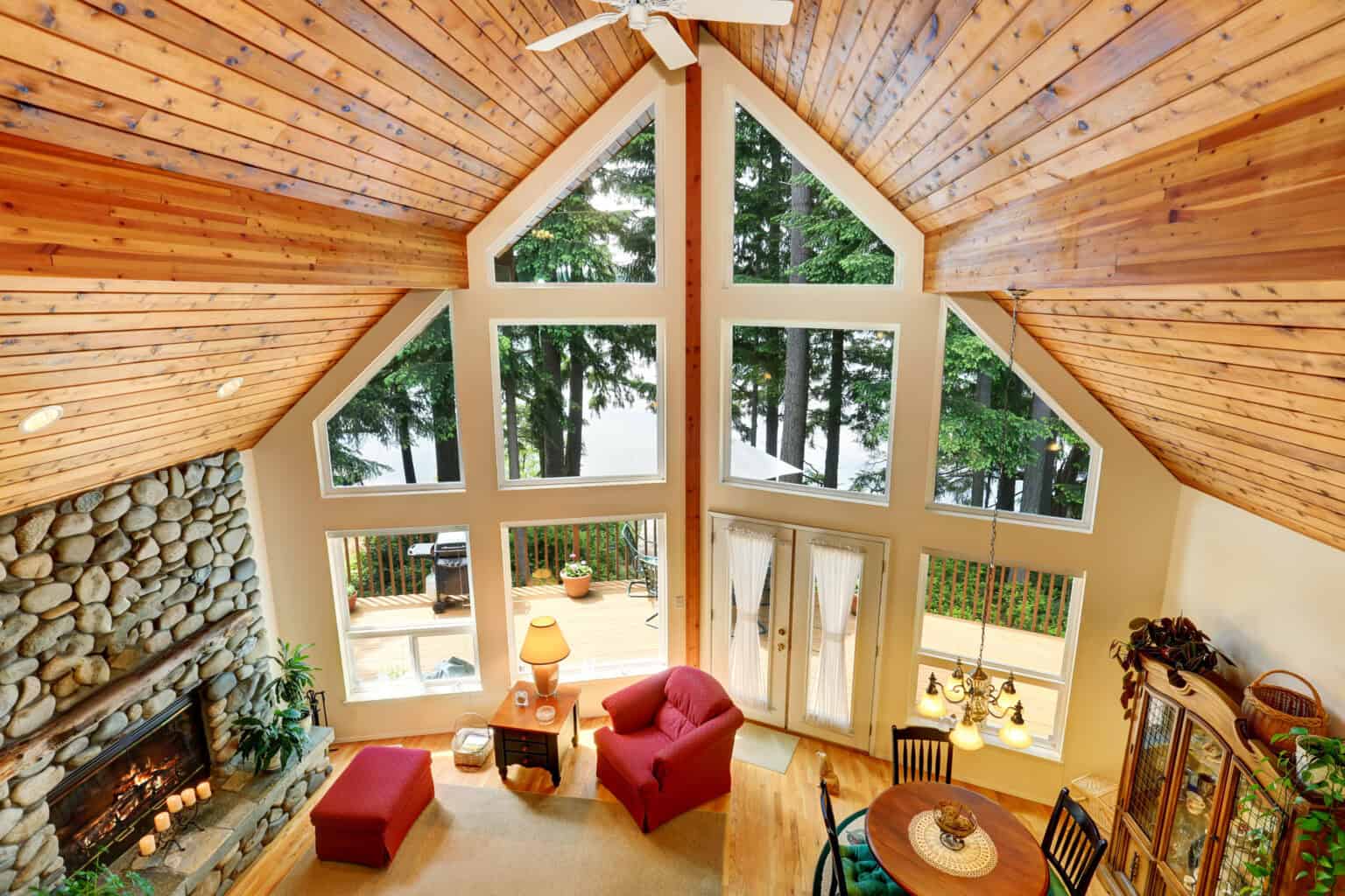 open floor plan living room interior with rocks trim fireplace