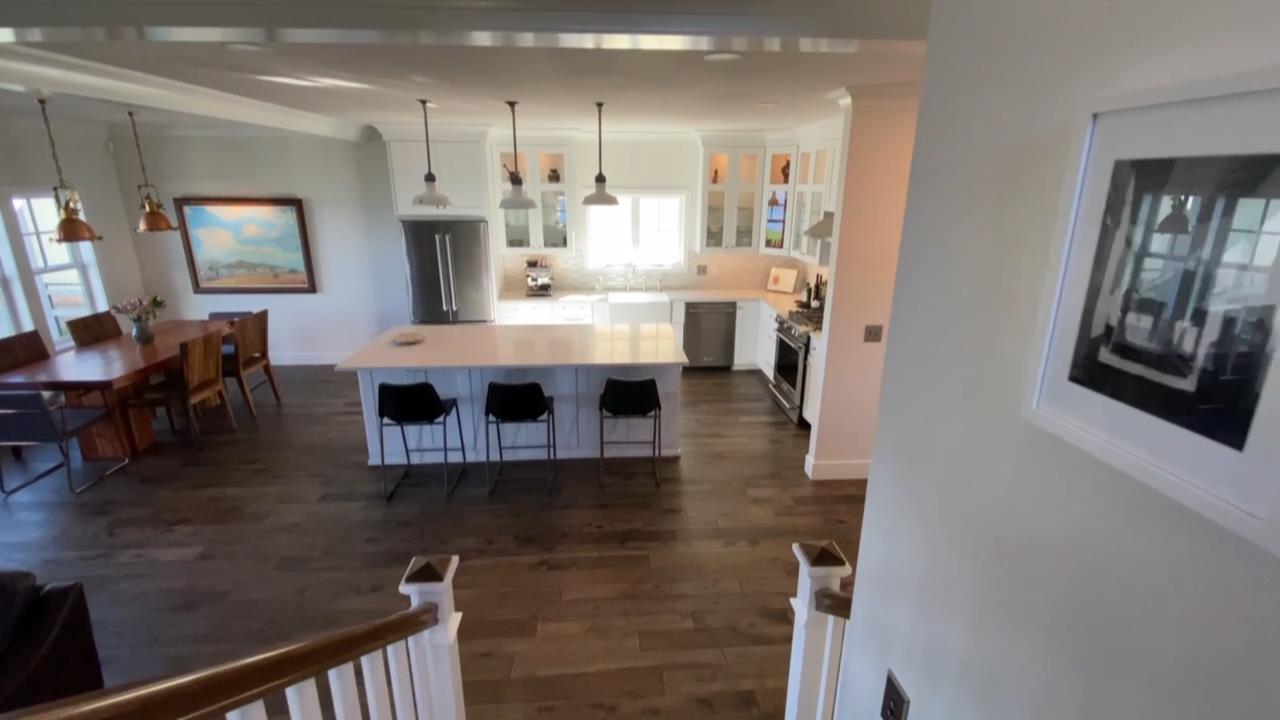 belfair custom home build staircase to kitchen