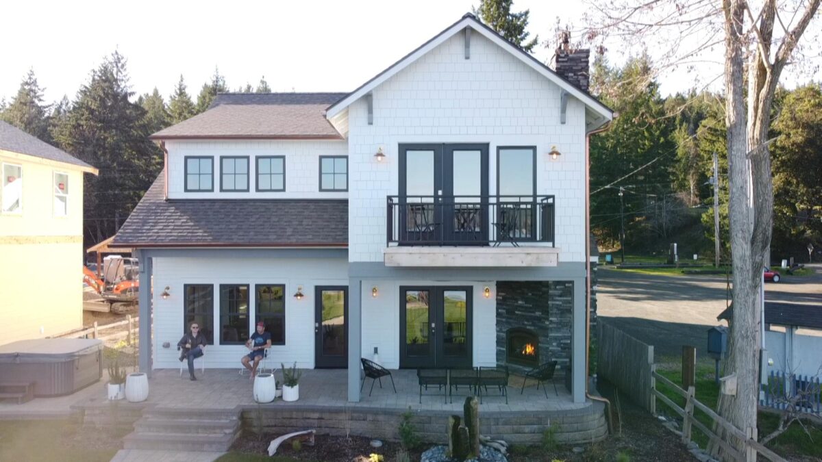 belfair custom home builder exterior with customers 1200x675