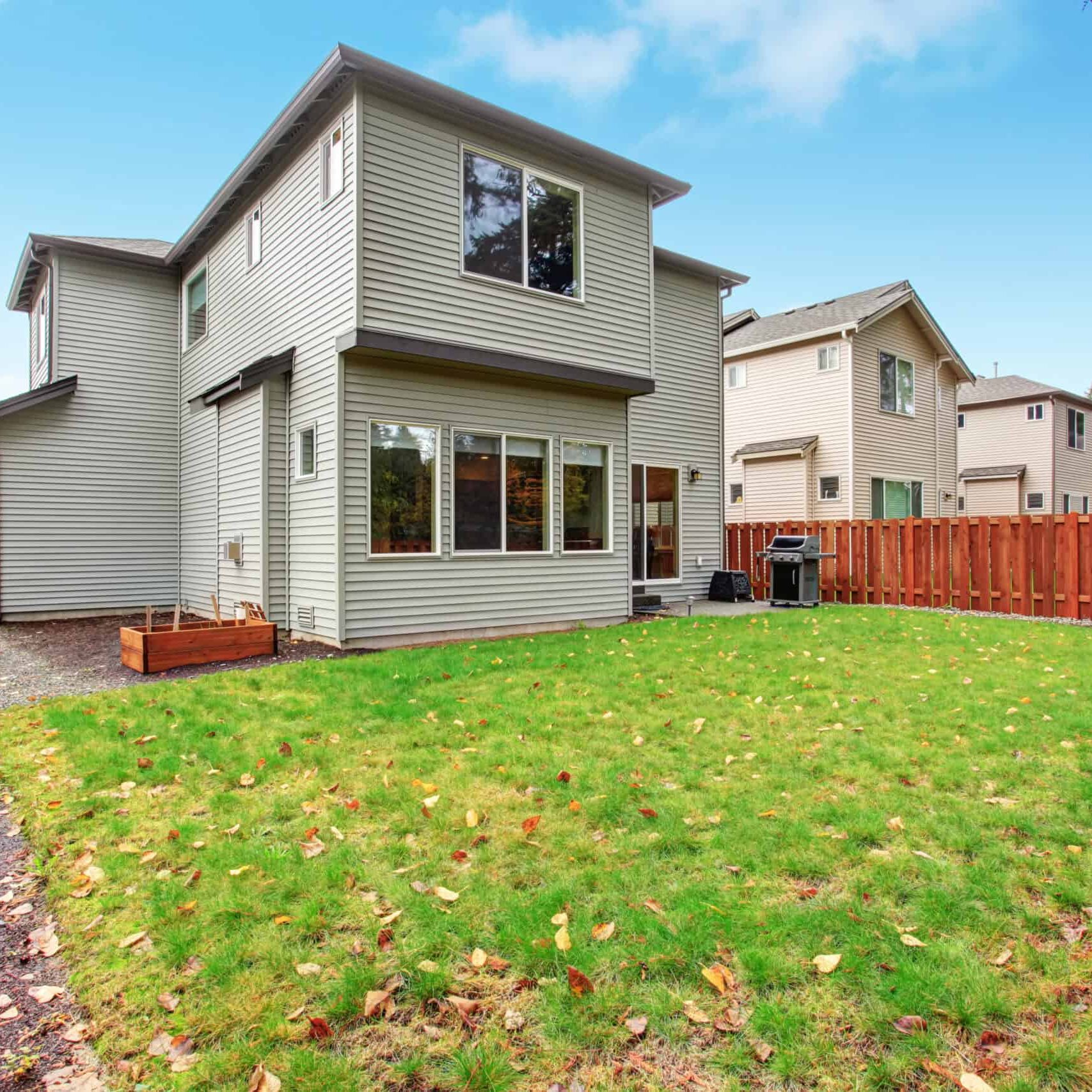 large backyard with lots of grass.
