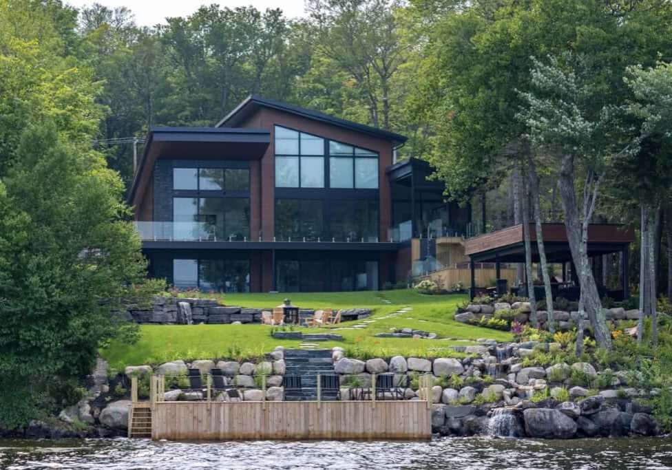lakefront luxury property on sunny day of summer