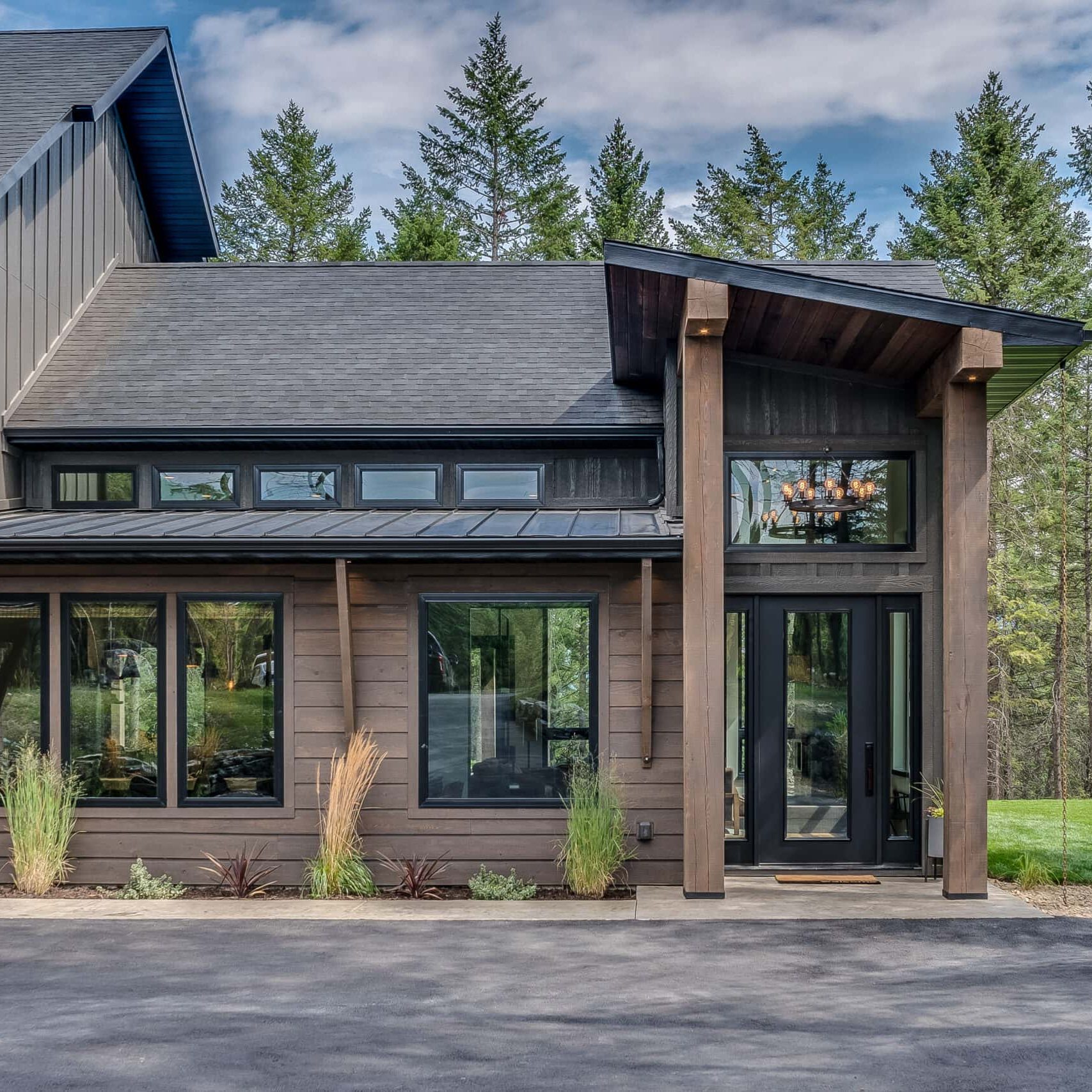 dark brown and black colors on modern home on large property in the country
